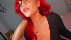 Redhair beauty with gkases deepthroating dildo